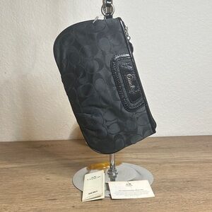 Coach Black Monogram Wristlet. Good condition zipper works perfectly